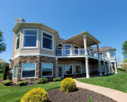 Residential home featuring a bay window, with a clean exterior
